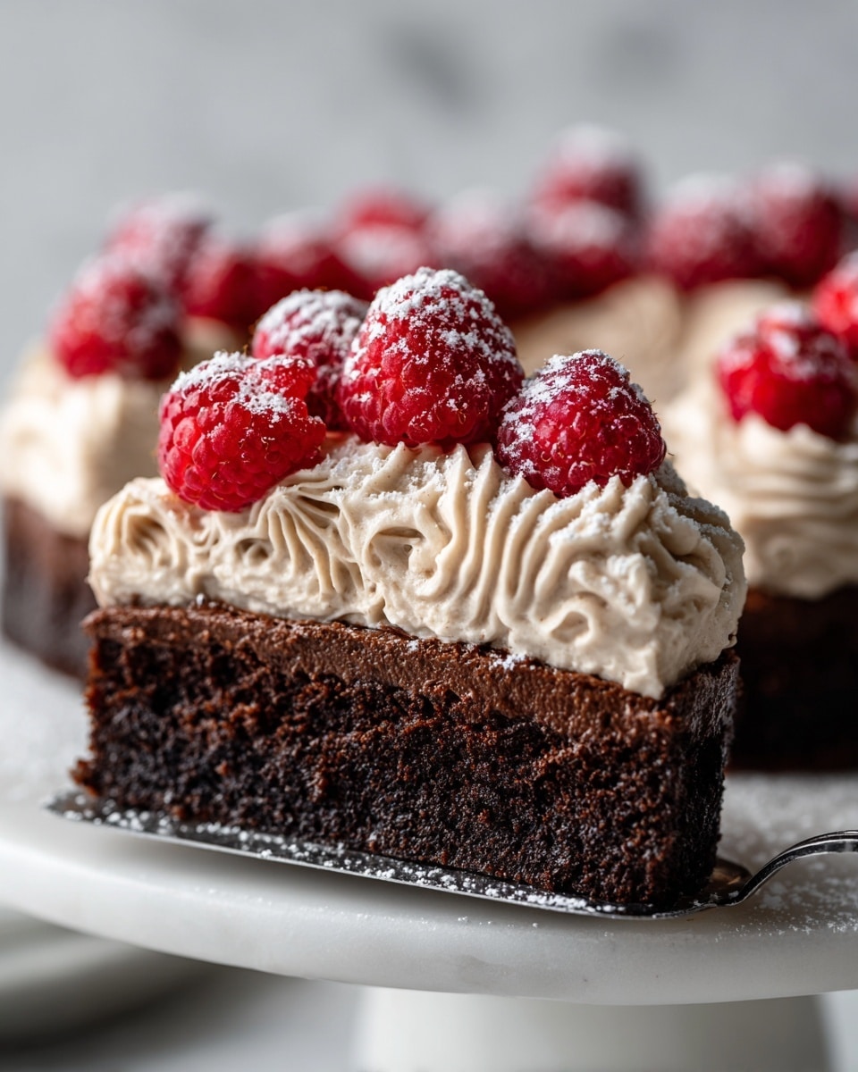 A single-layer dark chocolate cake sits on a white marbled cake stand, topped with two distinct decorative layers. The base layer is rich and dense, with a deep, dark brown color and slightly rough texture. On top of the cake, there is a circle of light brown piped chocolate cream swirls evenly spaced along the edge. Inside this ring, a layer of bright red raspberries fills the center, each berry dusted lightly with white powdered sugar, giving a fresh and delicate appearance. The background is a clean white marbled texture. photo taken with an iphone --ar 4:5 --v 7